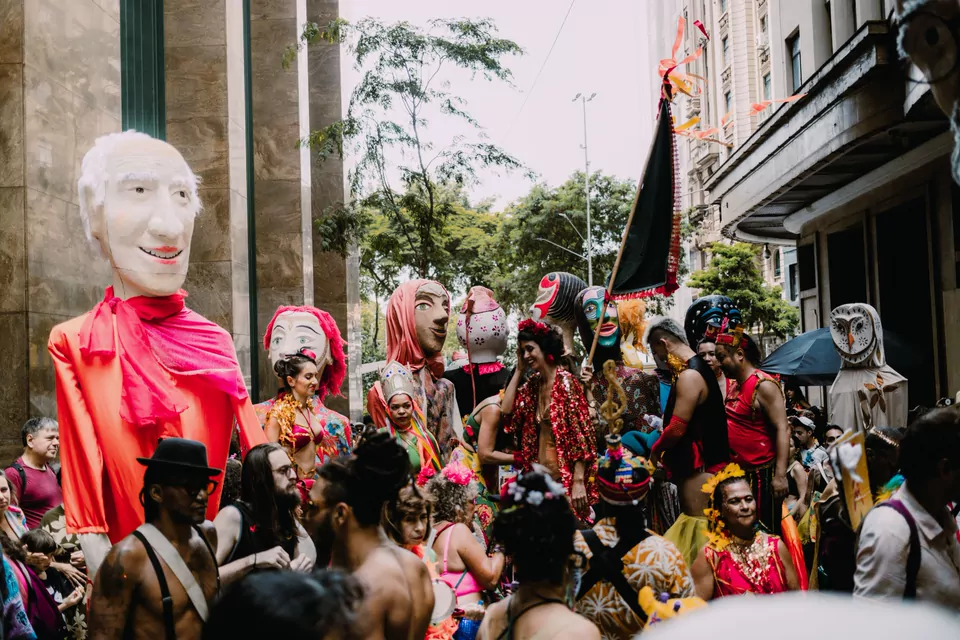 Colourful street parade with giant puppets and performers