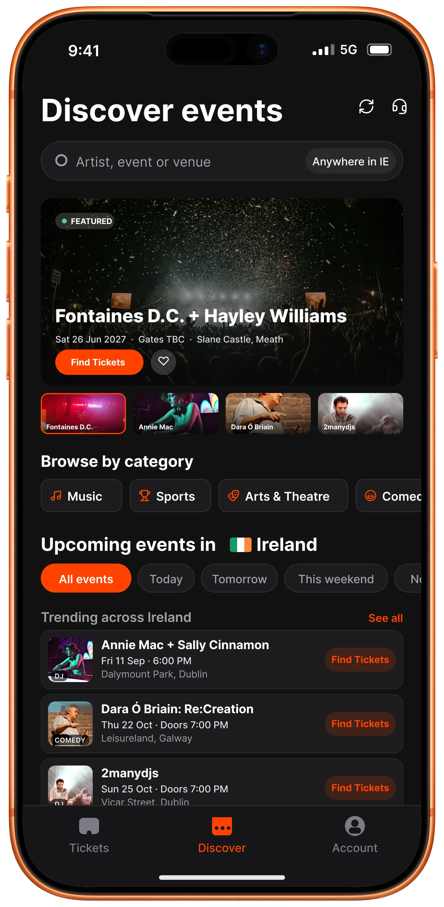 An iPhone showing the Discover screen of the TicketSoft app: a featured event across the top, then categories and upcoming events across Ireland.